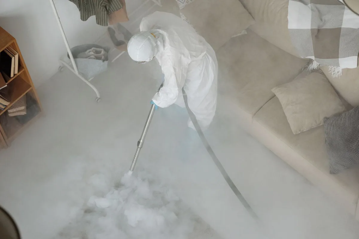 Biohazard cleanup technician in protective equipment, Chetek, WI